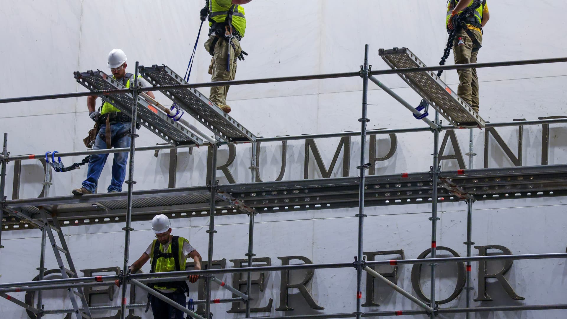 Workers begin removing Trump’s name from the Kennedy Center, hours after a court-ordered deadline