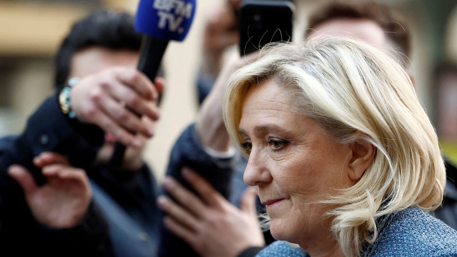 French court opens door for Marine Le Pen to run for president, with ankle tag