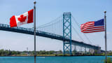 Trucks traverse the Ambassador Bridge, a main trade route linking Canada and the United States in Windsor, Ontario, Canada July 5, 2020.