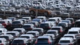 New cars of various brands are parked for export on the parking of a car terminal at the harbour of Duisburg, western Germany, on August 7, 2024.